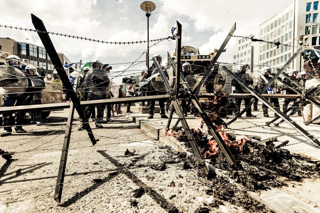 Streets with police and burning barricades